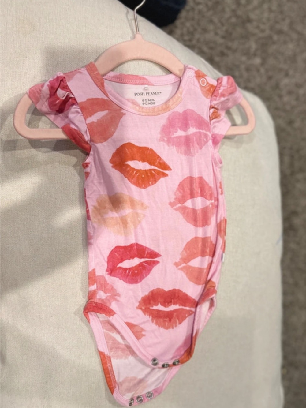 Baby girl ruffle onesie Isabela Posh Peanut Pink